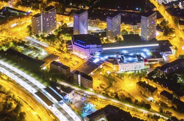 Aerial view, Mülheim an der Ruhr main station, Technical Town Hall and Forum City Mülheim shopping centre Hans-Böckler-Platz, Altstadt II, Mülheim an der Ruhr, Ruhr area, North Rhine-Westphalia, Germany, railway station, authority, DE, Deutsche Bahn AG, twilight photography, shopping centre, shopping square, shopping centre, Europe, central station, skyscrapers, light pollution, aerial view, aerial photography, aerial photography, night, night shot, night flight, fast cycle route, town hall, shopping, shopping centre, overview, bird's-eye view, illuminated streets, birds-eyes view, nightflight, overview