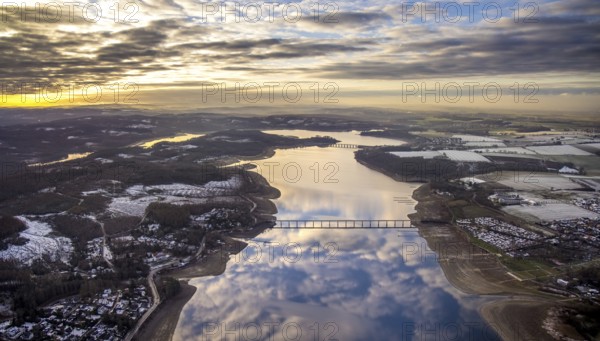 Aerial view of Lake Möhnesee in winter with snow and reflections of clouds on the water surface at low tide in Körbecke in Möhnesee in Sauerland in North Rhine-Westphalia, Germany, Möhnesee, Sauerland, North Rhine-Westphalia, DE, Europe, aerial photo, birds-eyes view, aerial photography, aerial photography, overview, bird's eye view