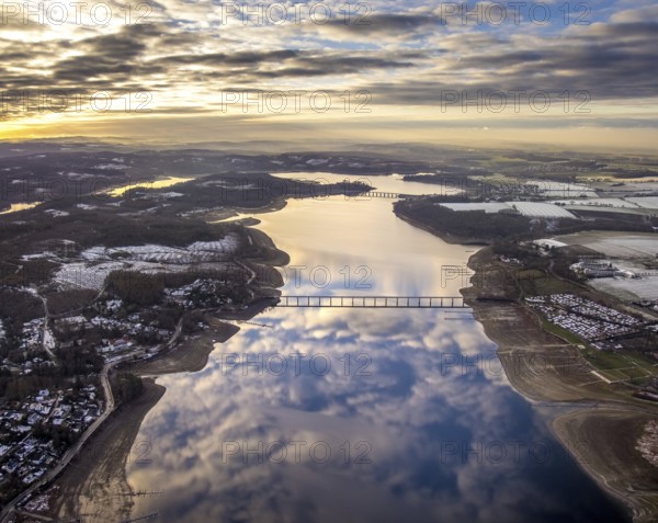Aerial view of Lake Möhnesee in winter with snow and reflections of clouds on the water surface at low tide in Körbecke in Möhnesee in Sauerland in North Rhine-Westphalia, Germany, Möhnesee, Sauerland, North Rhine-Westphalia, DE, Europe, aerial photo, birds-eyes view, aerial photography, aerial photography, overview, bird's eye view
