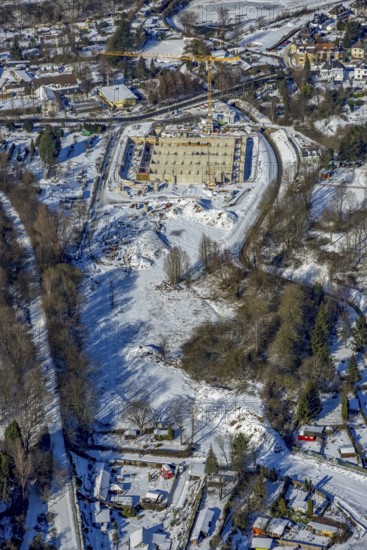 Aerial view, construction site of the Emschergenossenschaft, Köttelbecke renaturalisation, Frohnhauser Weg am Borbecker Mühlenbach, Heißen - Mitte, Mülheim an der Ruhr, Ruhr area, North Rhine-Westphalia, Germany, construction work, construction area, construction site, building site, construction project, construction site, DE, Emschergenossenschaft, Europe, aerial view, aerial photography, aerial photography, new construction, rainwater overflow basin, snow, overview, bird's eye view, winter, birds-eyes view, overview