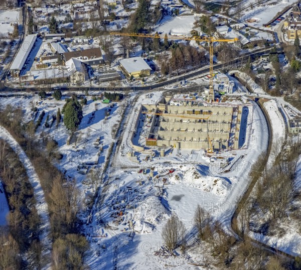 Aerial view, construction site of the Emschergenossenschaft, Köttelbecke renaturalisation, Frohnhauser Weg am Borbecker Mühlenbach, Heißen - Mitte, Mülheim an der Ruhr, Ruhr area, North Rhine-Westphalia, Germany, construction work, construction area, construction site, building site, construction project, construction site, DE, Emschergenossenschaft, Europe, aerial view, aerial photography, aerial photography, new construction, rainwater overflow basin, snow, overview, bird's eye view, winter, birds-eyes view, overview