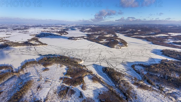 Aerial view, forest area Südlicher Randweg and Möhnesee, Brüningsen, Möhnesee, Sauerland, North Rhine-Westphalia, Germany, mountains and valleys, DE, Europe, distant view, hilly landscape, aerial view, aerial photography, aerial photography, cracks in the ice, snow, overview, bird's eye view, winter at Möhnesee, winter landscape, birds-eyes view, overview
