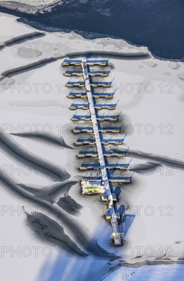 Aerial view, boat mooring sailing club Möhnesee Süd at the campsite Möhnesee, Brüningsen, Möhnesee, Sauerland, North Rhine-Westphalia, Germany, mountains and valleys, boat mooring, boat landing stage, camping, camping facility, camping houses, campsite, DE, Europe, distant view, leisure, hilly landscape, aerial view, aerial photography, aerial photography, cracks in the ice, snow, sailing club, southern shore, overview, bird's-eye view, winter at Lake Moehne, winter landscape, caravan, birds-eyes view, overview