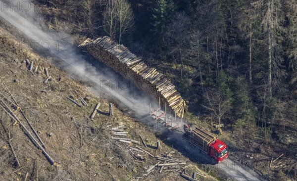 Forest damage, timber storage site and removal by lorry in the forest area near Neuhaus, Südrandweg, Möhnesee, Sauerland, North Rhine-Westphalia, Germany, tree mortality, DE, Europe, clear-cutting, aerial view, aerial photography, aerial photography, aerial photography, overview, bird's-eye view, forest area, forest mortality, birds-eyes view, overview
