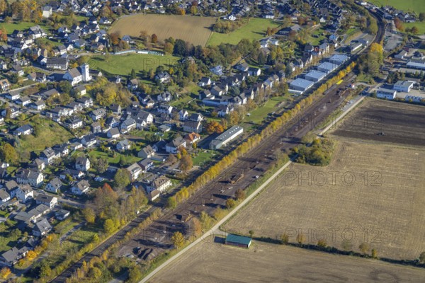 Aerial view, sawmill timber yard at the railway embankment in the district Wennemen in Meschede, Sauerland, North Rhine-Westphalia, Germany, DE, Europe, Im Ruhr Valley, aerial view, aerial photography, aerial photography, Meschede, sawmill Hüster, overview, bird's eye view, birds-eyes view, overview