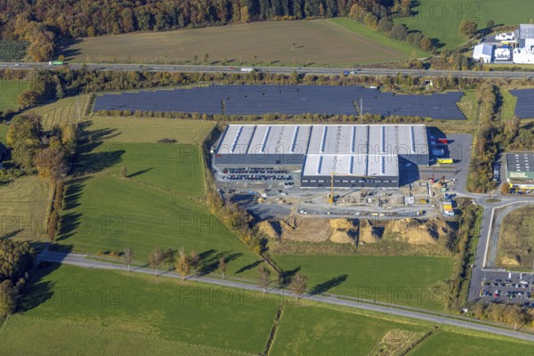 Aerial view, Brilon lights with solar park in the Enste industrial estate on the A46 motorway in the Enste district of Meschede, Sauerland, North Rhine-Westphalia, Germany, DE, Europe, commercial enterprises, commercial area, industrial estate, commercial park, commercial location, commercial use, industrial area, industrial building, industrial site, aerial view, aerial photography, aerial photography, Meschede, photovoltaic, photovoltaic plant, solar, solar plant, solar roof, solar energy, solar park, overview, bird's-eye view, overview