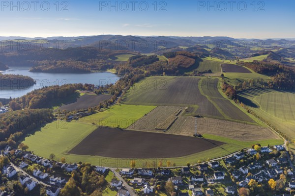 Aerial view, meadows and fields in autumnal hilly landscape at the Hennesee in the district Berghausen in Meschede, Sauerland, North Rhine-Westphalia, Germany, DE, Europe, Hennetalsperre, autumn colours, autumn forest, hilly landscape, aerial view, aerial photography, aerial photography, Meschede, overview, bird's eye view, meadows and fields, birds-eyes view, autumnal forest, overview