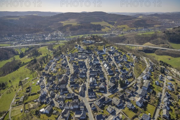 Aerial view, View of Eversberg, Ruins of Eversberg Castle, Schlossberghalle Eversberg, St.-Johannes-Evangelist-Kirche, Eversberg, Meschede, Sauerland, North Rhine-Westphalia, Germany, place of worship, castle, DE, Europe, religious community, place of worship, sacred site, church, parish, denomination, aerial view, aerial photography, aerial photography, religion, religious site, castle, castle hill, shooting hall, overview, bird's-eye view, birds-eyes view, overview