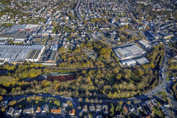 Aerial view, brownfield site on Carl-Benz-Straße between Hellweg Baumarkt and HME Copper Germany in Menden, Sauerland, North Rhine-Westphalia, Germany, construction area, construction site, building plots, DE, Europe, commercial enterprises, commercial area, commercial park, commercial site, commercial use, industrial area, industrial building, industrial site, aerial view, aerial photography, aerial photography, Menden, overview, bird's-eye view, overview