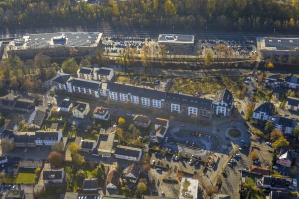 Aerial view, residential area and shopping centre Untere Promenade at the river Hönne in Menden, Sauerland, North Rhine-Westphalia, Germany, DE, shopping markets, shopping place, shopping centre, Europe, roundabout, roundabout, aerial view, aerial photography, aerial photography, Menden, local supply centre, supermarket, overview, bird's-eye view, overview