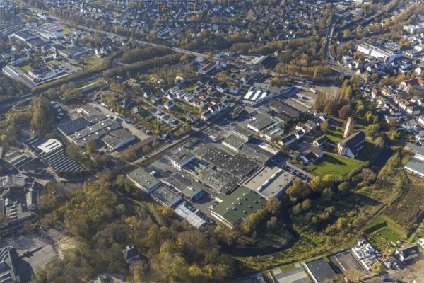 Aerial view, industrial estate Am Törnigskamp and cath. Heilig Kreuz Kirche in Menden, Sauerland, North Rhine-Westphalia, Germany, place of worship, DE, Europe, commercial enterprises, commercial area, commercial park, commercial site, commercial use, religious community, place of worship, holy site, industrial area, industrial building, industrial site, church, church community, denomination, aerial view, aerial photography, aerial photography, Menden, religion, religious site, overview, bird's-eye view, birds-eyes view, overview