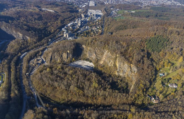 Aerial view, quarry at the Hönnetalstraße with commercial area and Rheinkalk GmbH in the district Oberrödinghausen in Menden, Sauerland, North Rhine-Westphalia, Germany, DE, Europe, commercial enterprises, commercial area, commercial park, commercial location, commercial use, industrial area, industrial building, industrial location, Kalköfenstraße, aerial view, aerial photography, aerial photography, Menden, quarry, overview, bird's eye view, birds-eyes view, overview
