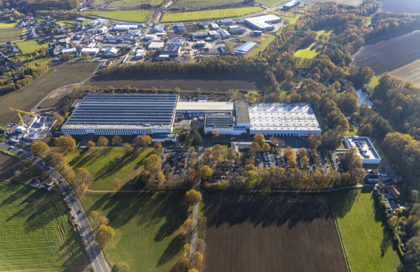 Aerial view, Bega Gantenbrink-Leuchten company premises with construction site in the Halingen district of Menden, Sauerland, North Rhine-Westphalia, Germany, construction work, construction area, building site, building plots, construction project, construction site, DE, Europe, commercial enterprises, commercial area, commercial park, commercial location, commercial use, industrial area, industrial building, industrial location, aerial photograph, aerial photography, aerial photography, Menden, new building, overview, bird's eye view, bird's eye view, overview