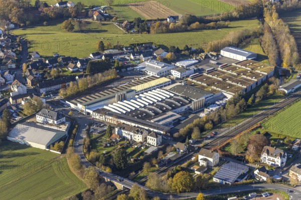 Aerial view, OBO Bettermann company premises in the Fröndenberger Straße industrial estate and Menden-Bösperde railway station in the Bösperde district of Menden, Sauerland, North Rhine-Westphalia, Germany, railway station, DE, Deutsche Bahn AG, Europe, commercial enterprises, commercial area, industrial estate, business park, commercial location, commercial use, industrial estate, industrial building, industrial location, aerial photograph, aerial photography, aerial photography, Menden, overview, bird's-eye view, bird's-eye view, overview