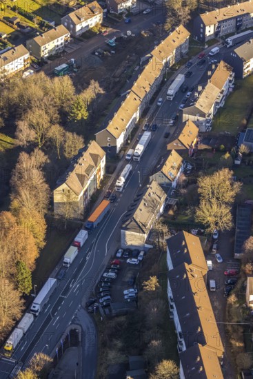 Aerial view, through road with truck traffic jam on the Lennestraße at the exit Lüdenscheid of the motorway A45 Sauerlandlinie because of the closed viaduct Rahmede in the district Leifringhausen in Lüdenscheid, Sauerland, North Rhine-Westphalia, Germany, A45, motorway junction, DE, Europe, truck traffic jam, aerial view, aerial photography, aerial photography, Lüdenscheid, through road, Sauerlandlinie, closure of the Rahmede viaduct, traffic jam, traffic jam, road traffic, overview, diversion, traffic volume, traffic chaos, traffic infrastructure, traffic jam, bird's eye view, birds-eyes view, dilapidated bridge, dilapidated bridges, overview