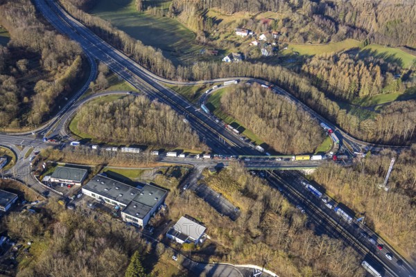 Aerial view, truck traffic jam at the Lüdenscheid exit of the A45 Sauerlandlinie motorway due to the closure of the Rahmede viaduct in the Leifringhausen district of Lüdenscheid, Sauerland, North Rhine-Westphalia, Germany, A45, motorway junction, Brunscheider Straße, DE, Europe, truck traffic jam, aerial view, aerial photography, aerial photography, Lüdenscheid, through road, Sauerlandlinie, closure of the Rahmede viaduct, traffic jam, traffic jam, road traffic, overview, diversion, traffic volume, traffic chaos, traffic infrastructure, traffic jam, bird's eye view, birds-eyes view, closed Rahmede viaduct, dilapidated bridge, dilapidated bridges, overview