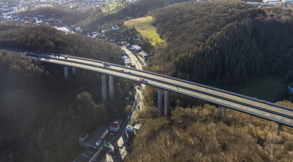 Aerial photograph, construction work with emergency reinforcement on the dilapidated and closed Rahmede viaduct of the A45 Sauerlandlinie motorway over Altenaer Straße in the Gevelndorf district of Lüdenscheid, Sauerland, North Rhine-Westphalia, Germany, A45, construction work, construction measure, construction site, DE, Europe, aerial photograph, aerial photography, aerial photography, Lüdenscheid, emergency reinforcement, through road, Rahmede valley bridge, Sauerland line, closure of the Rahmede valley bridge, traffic jam, traffic jams, overview, traffic chaos, traffic infrastructure, traffic jam, bird's eye view, forest area, birds-eyes view, lack of load-bearing capacity, dilapidated bridge, dilapidated bridges, overview