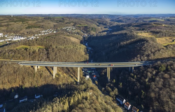 Aerial photograph, construction work with emergency reinforcement on the dilapidated and closed Rahmede viaduct of the A45 Sauerlandlinie motorway over Altenaer Straße in the Gevelndorf district of Lüdenscheid, Sauerland, North Rhine-Westphalia, Germany, A45, construction work, construction measure, construction site, DE, Europe, aerial photograph, aerial photography, aerial photography, Lüdenscheid, emergency reinforcement, through road, Rahmede valley bridge, Sauerland line, closure of the Rahmede valley bridge, traffic jam, traffic jams, overview, traffic chaos, traffic infrastructure, traffic jam, bird's eye view, forest area, birds-eyes view, lack of load-bearing capacity, dilapidated bridge, dilapidated bridges, overview