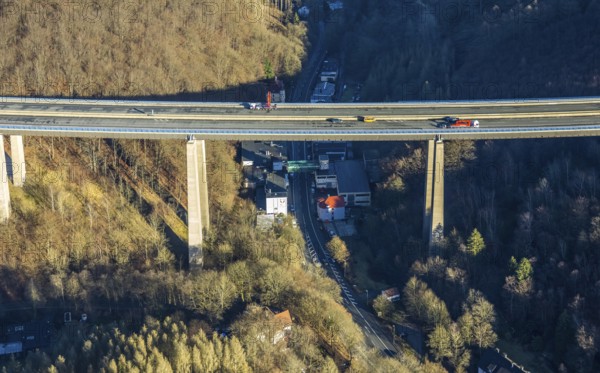 Aerial photograph, construction work with emergency reinforcement on the dilapidated and closed Rahmede viaduct of the A45 Sauerlandlinie motorway over Altenaer Straße in the Gevelndorf district of Lüdenscheid, Sauerland, North Rhine-Westphalia, Germany, A45, construction work, construction measure, construction site, DE, Europe, aerial photograph, aerial photography, aerial photography, Lüdenscheid, emergency reinforcement, through road, Rahmede valley bridge, Sauerland line, closure of the Rahmede valley bridge, traffic jam, traffic jams, overview, traffic chaos, traffic infrastructure, traffic jam, bird's eye view, forest area, birds-eyes view, lack of load-bearing capacity, dilapidated bridge, dilapidated bridges, overview