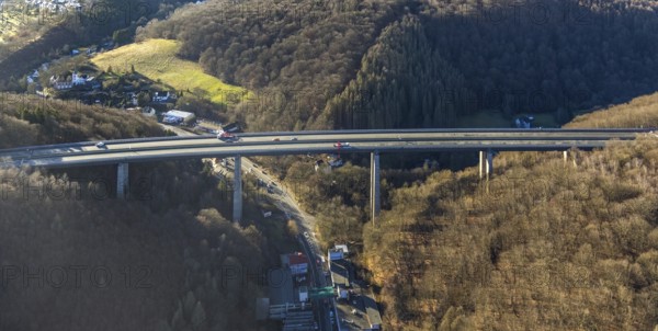 Aerial photograph, construction work with emergency reinforcement on the dilapidated and closed Rahmede viaduct of the A45 Sauerlandlinie motorway over Altenaer Straße in the Gevelndorf district of Lüdenscheid, Sauerland, North Rhine-Westphalia, Germany, A45, construction work, construction measure, construction site, DE, Europe, aerial photograph, aerial photography, aerial photography, Lüdenscheid, emergency reinforcement, through road, Rahmede valley bridge, Sauerland line, closure of the Rahmede valley bridge, traffic jam, traffic jams, overview, traffic chaos, traffic infrastructure, traffic jam, bird's eye view, forest area, birds-eyes view, lack of load-bearing capacity, dilapidated bridge, dilapidated bridges, overview