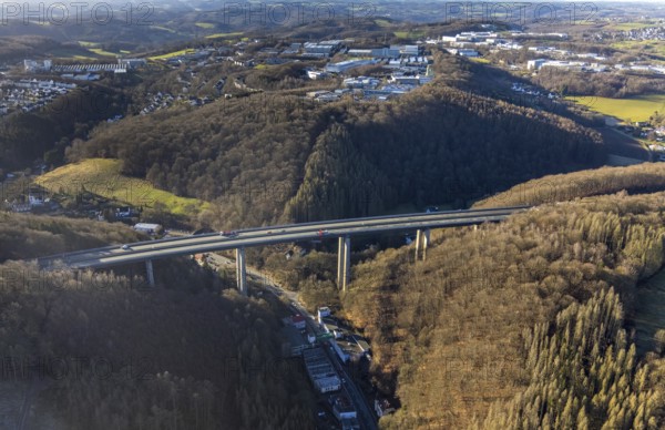 Aerial photograph, construction work with emergency reinforcement on the dilapidated and closed Rahmede viaduct of the A45 Sauerlandlinie motorway over Altenaer Straße in the Gevelndorf district of Lüdenscheid, Sauerland, North Rhine-Westphalia, Germany, A45, construction work, construction measure, construction site, DE, Europe, aerial photograph, aerial photography, aerial photography, Lüdenscheid, emergency reinforcement, through road, Rahmede valley bridge, Sauerland line, closure of the Rahmede valley bridge, traffic jam, traffic jams, overview, traffic chaos, traffic infrastructure, traffic jam, bird's eye view, forest area, birds-eyes view, lack of load-bearing capacity, dilapidated bridge, dilapidated bridges, overview