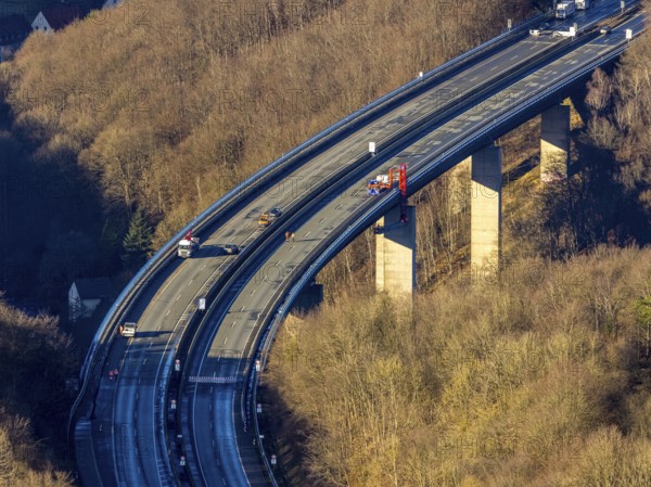 Aerial photograph, construction work with emergency reinforcement on the dilapidated and closed Rahmede viaduct of the A45 Sauerlandlinie motorway over Altenaer Straße in the Gevelndorf district of Lüdenscheid, Sauerland, North Rhine-Westphalia, Germany, A45, construction work, construction measure, construction site, DE, Europe, aerial photograph, aerial photography, aerial photography, Lüdenscheid, emergency reinforcement, through road, Rahmede valley bridge, Sauerland line, closure of the Rahmede valley bridge, traffic jam, traffic jams, overview, traffic chaos, traffic infrastructure, traffic jam, bird's eye view, forest area, birds-eyes view, lack of load-bearing capacity, dilapidated bridge, dilapidated bridges, overview
