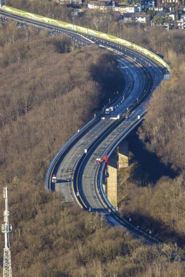 Aerial photograph, construction work with emergency reinforcement on the dilapidated and closed Rahmede viaduct of the A45 Sauerlandlinie motorway over Altenaer Straße in the Gevelndorf district of Lüdenscheid, Sauerland, North Rhine-Westphalia, Germany, A45, construction work, construction measure, construction site, DE, Europe, aerial photograph, aerial photography, aerial photography, Lüdenscheid, emergency reinforcement, through road, Rahmede valley bridge, Sauerland line, closure of the Rahmede valley bridge, traffic jam, traffic jams, overview, traffic chaos, traffic infrastructure, traffic jam, bird's eye view, forest area, birds-eyes view, lack of load-bearing capacity, dilapidated bridge, dilapidated bridges, overview