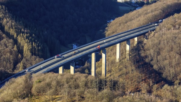 Aerial photograph, construction work with emergency reinforcement on the dilapidated and closed Rahmede viaduct of the A45 Sauerlandlinie motorway over Altenaer Straße in the Gevelndorf district of Lüdenscheid, Sauerland, North Rhine-Westphalia, Germany, A45, construction work, construction measure, construction site, DE, Europe, aerial photograph, aerial photography, aerial photography, Lüdenscheid, emergency reinforcement, through road, Rahmede valley bridge, Sauerland line, closure of the Rahmede valley bridge, traffic jam, traffic jams, overview, traffic chaos, traffic infrastructure, traffic jam, bird's eye view, forest area, birds-eyes view, lack of load-bearing capacity, dilapidated bridge, dilapidated bridges, overview