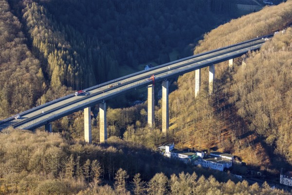Aerial photograph, construction work with emergency reinforcement on the dilapidated and closed Rahmede viaduct of the A45 Sauerlandlinie motorway over Altenaer Straße in the Gevelndorf district of Lüdenscheid, Sauerland, North Rhine-Westphalia, Germany, A45, construction work, construction measure, construction site, DE, Europe, aerial photograph, aerial photography, aerial photography, Lüdenscheid, emergency reinforcement, through road, Rahmede valley bridge, Sauerland line, closure of the Rahmede valley bridge, traffic jam, traffic jams, overview, traffic chaos, traffic infrastructure, traffic jam, bird's eye view, forest area, birds-eyes view, lack of load-bearing capacity, dilapidated bridge, dilapidated bridges, overview