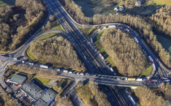 Aerial view, truck traffic jam at the Lüdenscheid exit of the A45 Sauerlandlinie motorway due to the closure of the Rahmede viaduct in the Leifringhausen district of Lüdenscheid, Sauerland, North Rhine-Westphalia, Germany, A45, motorway junction, Brunscheider Straße, DE, Europe, truck traffic jam, aerial view, aerial photography, aerial photography, Lüdenscheid, through road, Sauerlandlinie, closure of the Rahmede viaduct, traffic jam, traffic jam, road traffic, overview, diversion, traffic volume, traffic chaos, traffic infrastructure, traffic jam, bird's eye view, birds-eyes view, closed Rahmede viaduct, dilapidated bridge, dilapidated bridges, overview