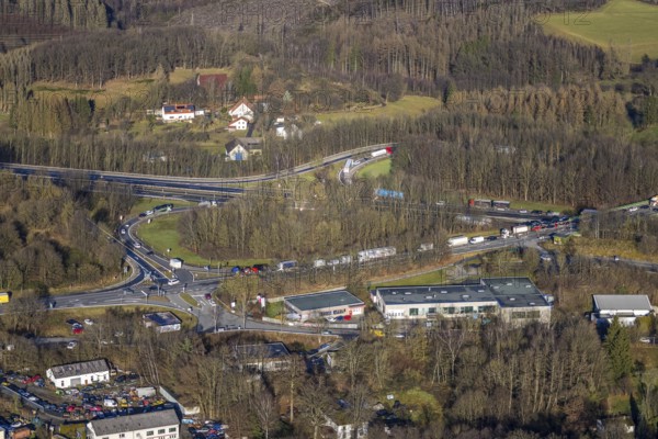 Aerial view, truck traffic jam at the Lüdenscheid exit of the A45 Sauerlandlinie motorway due to the closure of the Rahmede viaduct in the Leifringhausen district of Lüdenscheid, Sauerland, North Rhine-Westphalia, Germany, A45, motorway junction, Brunscheider Straße, DE, Europe, truck traffic jam, aerial view, aerial photography, aerial photography, Lüdenscheid, through road, Sauerlandlinie, closure of the Rahmede viaduct, traffic jam, traffic jam, road traffic, overview, diversion, traffic volume, traffic chaos, traffic infrastructure, traffic jam, bird's eye view, birds-eyes view, closed Rahmede viaduct, dilapidated bridge, dilapidated bridges, overview