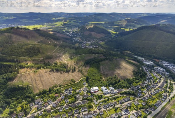 Aerial photo, Berufskolleg des Kreises Olpe, forest area and forest damage Kirchhundem Altenhundem, Lennestadt, Sauerland, North Rhine-Westphalia, Germany, tree dieback, vocational school, education, educational institution, bark beetle damage, bark beetle plague, DEU, Europe, spruce dieback, clear cutting, college, teaching institute, aerial photo, aerial photography, aerial photography, school, overview, bird's-eye view, forest, forest damage, forest dieback, birds-eyes view, overview