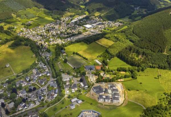 Aerial view, new senior-friendly residential complex WohnGut, spa and community centre, natural adventure pool Lennestadt- Saalhausen, Marien-Grundschule, Saalhausen, Lennestadt, Sauerland, North Rhine-Westphalia, Germany, retirement home, old people's home, construction work, construction area, building site, building plots, construction project, construction site, care and nursing, education, educational institution, DEU, Europe, Fasanenweg, leisure facility, primary school, spa hotel, teaching institute, aerial view, aerial photography, aerial photography, new building, care facility, school, retirement home, retirement residence, retirement home, retirement centre, overview, bird's-eye view, bird's-eye view, overview