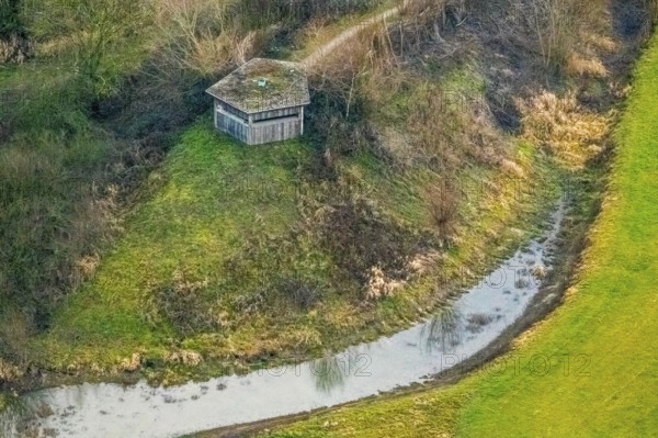 Aerial view of the national nature reserve Lippeauen at the river Lippe with the observation hut Disselmersch near Heintrop in Lippetal in North Rhine-Westphalia, Germany. Geese fly over the river Lippe, Lippetal, Ruhr area, North Rhine-Westphalia, Germany, DE, Europe, aerial photo, birds-eyes view, aerial photography, aerial photography, overview, bird's eye view