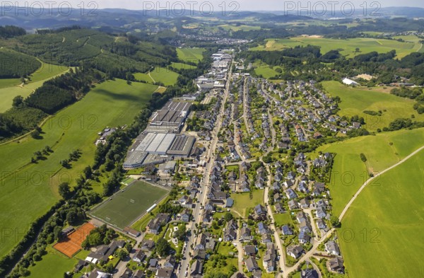 Aerial view, aerial view Elspe with commercial area Bielefelder Straße and sports field Elspe, Lennestadt, Sauerland, North Rhine-Westphalia, Germany, DEU, Europe, football pitch, football stadium, commercial enterprises, commercial area, commercial park, commercial location, commercial use, industrial area, industrial building, industrial location, aerial view, aerial photography, aerial photography, sports, sports facilities, sports field, sports facility, overview, bird's eye view, birds-eyes view, overview