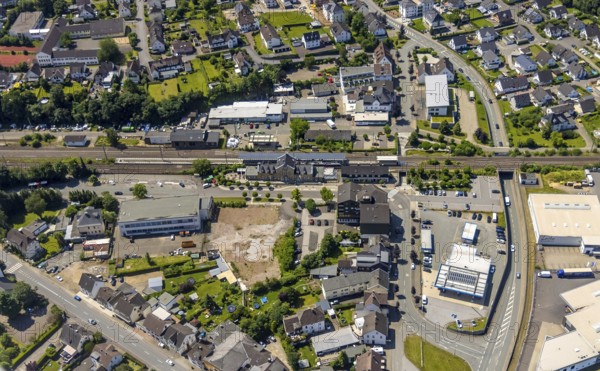 Aerial view, Lennestadt-Grevenbrück railway station, EssBahnhof and KulturBahnhof, brownfield site at the forecourt, Lennestadt, Sauerland, North Rhine-Westphalia, Germany, railway station, station forecourt, building site, building plots, DEU, Deutsche Bahn AG, Europe, gastronomy, main station, main station, culture, art, aerial view, aerial photography, aerial photography, restaurant, overview, event location, bird's-eye view, birds-eyes view, cultural use, overview