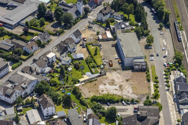 Aerial view, Lennestadt-Grevenbrück railway station, wasteland at the forecourt, Lennestadt, Sauerland, North Rhine-Westphalia, Germany, railway station, station forecourt, building site, building plots, DEU, Deutsche Bahn AG, Europe, gastronomy, main station, main railway station, culture, art, aerial view, aerial photography, aerial photography, restaurant, overview, event location, bird's-eye view, birds-eyes view, cultural use, overview