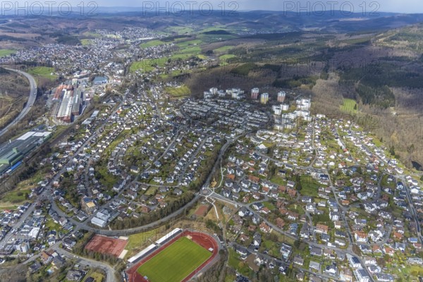 Aerial view, view of Kreuztal and Stählerwiese stadium, roundabout and construction site Hessengarten corner Zum Erbstollen, new footpath and cycle path, Kreuztal, Sauerland, North Rhine-Westphalia, Germany, construction work, construction area, building site, building plots, construction project, construction site, DE, Europe, football pitch, football stadium, Siegen-Wittgenstein district, roundabout, roundabout, athletics stadium, aerial view, aerial photography, aerial photography, sports, sports facilities, sports field, sports facility, overview, bird's-eye view, overview