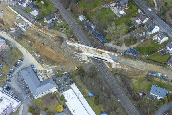 Aerial view, construction site and replacement construction of the DB bridge and new road construction B517, Eichen district, Kreuztal, Sauerland, North Rhine-Westphalia, Germany, construction work, construction site, building site, building plots, construction project, construction site, bridge, DE, Europe, Hagener Straße, Siegen-Wittgenstein district, aerial photograph, aerial photography, aerial photography, new construction, overview, bird's-eye view, overview, thyssenkrupp Stahlkontor Zweigniederlassung der thyssenkrupp Schulte GmbH