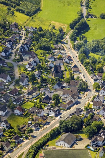 Aerial view, view of Oberelspe, federal road 55 and catholic church St. Maria Immaculata, Lennestadt, Sauerland, North Rhine-Westphalia, Germany, place of worship, mountains and valleys, DEU, Europe, football pitch, religious community, place of worship, property tax, holy place, real estate, church, parish, denomination, aerial view, aerial photography, aerial photography, religion, religious site, sports, sports facilities, sports field, sports facility, overview, bird's-eye view, forest, forest area, residential area, housing and living, residential area, residential buildings, quality of living, birds-eyes view, overview