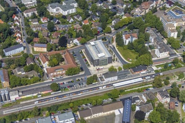 Aerial view, Kamen railway station with multi-storey car park and building of the Unna district police authority, Kamen police station, Kamen, Ruhr area, North Rhine-Westphalia, Germany, eye of the law, railway station, station forecourt, DE, Deutsche Bahn AG, Europe, railway tracks, main railway station, main station, aerial view, aerial photography, aerial photography, law enforcement officer, multi-storey car park, police, police station, police station, state authority, state power, overview, bird's-eye view, bird's-eye view, overview