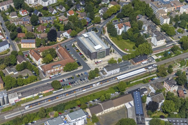 Aerial view, Kamen railway station with multi-storey car park and building of the Unna district police authority, Kamen police station, Kamen, Ruhr area, North Rhine-Westphalia, Germany, eye of the law, railway station, station forecourt, DE, Deutsche Bahn AG, Europe, railway tracks, main railway station, main station, aerial view, aerial photography, aerial photography, law enforcement officer, multi-storey car park, police, police station, police station, state authority, state power, overview, bird's-eye view, bird's-eye view, overview