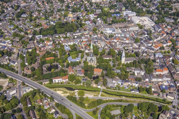 Aerial view, city centre with catholic parish church Zur Heiligen Familie and evang. Pauluskirche, Sesekepark between Maibrücke and Hochstraße with river Seseke in Kamen, Ruhr area, North Rhine-Westphalia, Germany, place of worship, federal road B233, City, DE, Europe, religious community, place of worship, holy place, city centre, Kamen, church, parish, denomination, aerial view, aerial photography, aerial photography, site view, park, religion, religious site, townscape, urban area, city centre, overview, bird's eye view, bird's eye view, overview