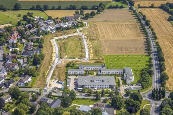 Aerial view, Peter and Paul retirement centre and construction site of a climate protection settlement in the new development area south of Methler village on Kiebitzweg in the Methler district, Kamen, Ruhr area, North Rhine-Westphalia, Germany, retirement home, old people's home, construction work, construction area, construction site, building plots, construction, construction project, construction site, care and nursing, DE, Europe, aerial view, aerial photography, aerial photography, new construction, care facility, retirement home, retirement home, retirement home, retirement centre, overview, bird's eye view, housing estate, birds-eyes view, overview