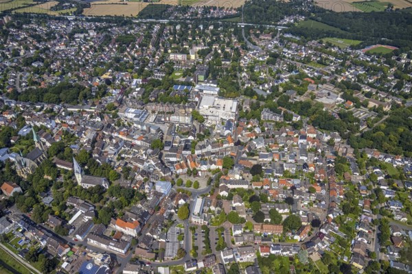 Aerial view, city centre with Alter Markt and catholic parish church Zur Heiligen Familie and protestant church Pauluskirche in Kamen, Ruhr area, North Rhine-Westphalia, Germany, place of worship, city, DE, Europe, religious community, place of worship, holy place, city centre, Kamen, church, parish, denomination, aerial view, aerial photography, aerial photography, market place, town view, religion, religious place, townscape, city area, city centre, overview, bird's eye view, birds-eyes view, overview