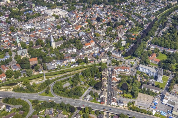 Aerial view, city centre with Sesekepark between Maibrücke and Hochstraße with river Seseke and catholic parish church Zur Heiligen Familie and evang. Pauluskirche in Kamen, Ruhr area, North Rhine-Westphalia, Germany, place of worship, federal road B233, City, DE, Europe, religious community, place of worship, holy place, city centre, Kamen, church, parish, denomination, aerial view, aerial photography, aerial photography, market place, town view, park, religion, religious site, townscape, urban area, city centre, overview, bird's-eye view, overview