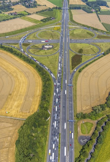 Aerial view, Kamen interchange with A1 motorway and A2 motorway, helicopter sculpture Yellow Angel in inner circle, Kamen, Ruhr area, North Rhine-Westphalia, Germany, motorway, Kamen interchange, DE, Europe, shapes and colours, clover shape, aerial view, aerial photography, aerial photography, road traffic, overview, traffic volume, bird's-eye view, overview