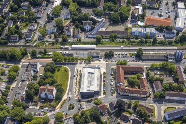 Aerial view, Kamen railway station with multi-storey car park and building of the Unna district police authority, Kamen police station, Kamen, Ruhr area, North Rhine-Westphalia, Germany, eye of the law, railway station, station forecourt, DE, Deutsche Bahn AG, Europe, railway tracks, main railway station, main station, aerial view, aerial photography, aerial photography, law enforcement officer, multi-storey car park, police, police station, police station, state authority, state power, overview, bird's-eye view, bird's-eye view, overview