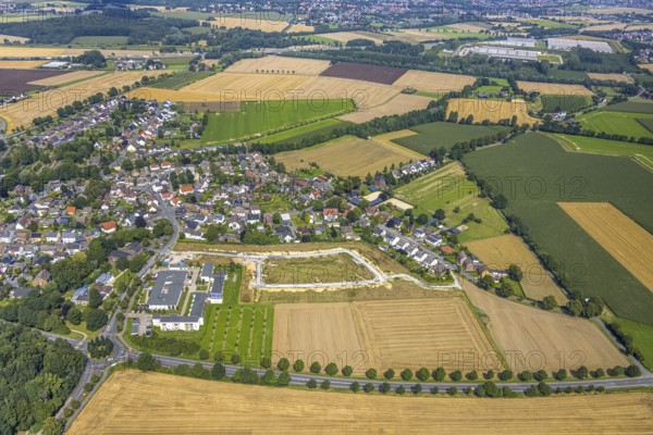 Aerial view, Peter and Paul retirement centre and construction site of a climate protection settlement in the new development area south of Methler village on Kiebitzweg in the Methler district, Kamen, Ruhr area, North Rhine-Westphalia, Germany, retirement home, old people's home, construction work, construction area, construction site, building plots, construction, construction project, construction site, care and nursing, DE, Europe, aerial view, aerial photography, aerial photography, new construction, care facility, retirement home, retirement home, retirement home, retirement centre, overview, bird's eye view, housing estate, birds-eyes view, overview
