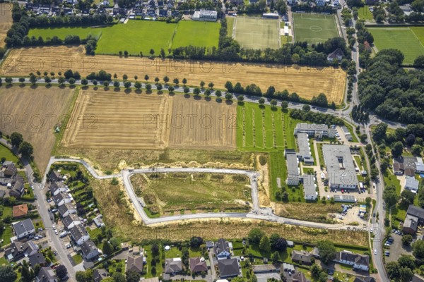 Aerial view, Peter and Paul retirement centre and construction site of a climate protection settlement in the new development area south of Methler village on Kiebitzweg in the Methler district, Kamen, Ruhr area, North Rhine-Westphalia, Germany, retirement home, old people's home, construction work, construction area, construction site, building plots, construction, construction project, construction site, care and nursing, DE, Europe, aerial view, aerial photography, aerial photography, new construction, care facility, retirement home, retirement home, retirement home, retirement centre, overview, bird's eye view, housing estate, birds-eyes view, overview